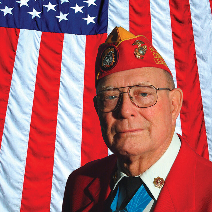 veteran in front of American Flag